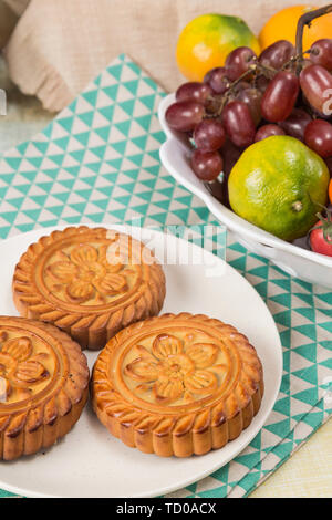 Moon cakes and fruit on the table Stock Photo