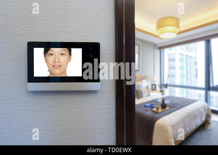 intercom video door bell on the wall outside modern bedroom Stock Photo