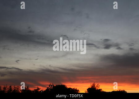 About two minutes before and after the sunset, the light changes are particularly obvious. Stock Photo