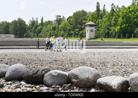 Dachau, Deutschland. 10th June, 2019. Visitors in the memorial concentration camp Dachau- Gedenkstaette, watchtower, 1933, 1945, 3, antisewithism, exterminate, extermination, Bavaria, Dachau, deportation, German, German history, Germany, third, Europe, fascism, fascists, fascist, commemoration, memorial, History, Jew, concentration camp, concentration camp, memorial, Nazism, Nazi, Nazi, Nazi, Reich, crime, past, extermination, extermination camp | usage worldwide Credit: dpa/Alamy Live News Stock Photo