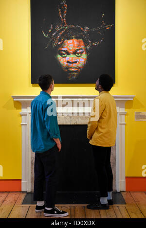 London, UK. 11 June 2019. Gallery staff view 'Self Portrait (After Warhol) 6', 2013, by Yinka Shonibare at the preview of a major new exhibition 'Get up, Stand Up Now' at Somerset House which runs 12 June to 15 September 2019.  The exhibition celebrates over 50 years of Black creativity in Britain and beyond, showcasing works by over 100 artists.  Credit: Stephen Chung / Alamy Live News Stock Photo