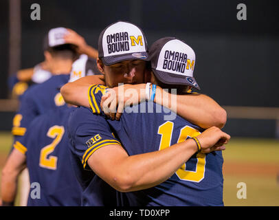Los Angeles, CA, USA. 09th June, 2019. Two Michigan players embrace after an NCAA super regional game between the Michigan Wolverines and the UCLA Bruins at Jackie Robinson Stadium in Los Angeles, California. Michigan defeated UCLA 4-2. (Mandatory Credit: Juan Lainez/MarinMedia.org/Cal Sport Media) Credit: csm/Alamy Live News Stock Photo
