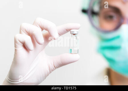 Virus pandemic warning, doctor recommending vaccine, disease prevention .  Stock Photo