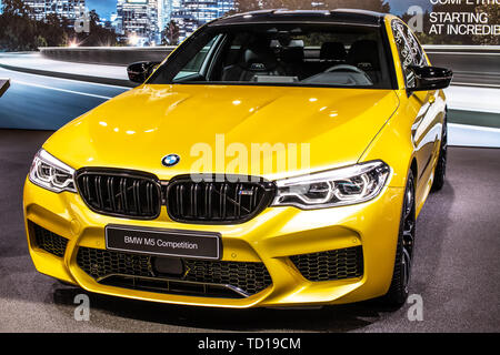 Geneva, Switzerland, March 05, 2019: metallic yellow BMW M5 Sedan Competition at Geneva International Motor Show, manufactured and marketed by BMW Stock Photo