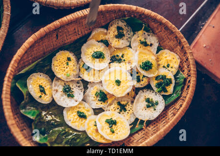 Vietnamese mini fried eggs, cooking on the street - Traditional Vietnamese foo Stock Photo