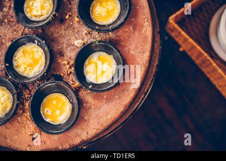 Vietnamese mini fried eggs, cooking on the street - Traditional Vietnamese foo Stock Photo