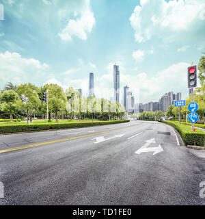 asphalt road and skyscrapers of modern city Stock Photo