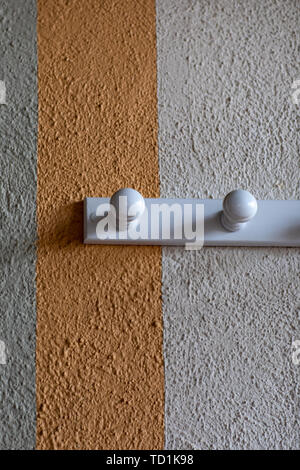 Coat rack and wall box with different colors and texture with relief Stock Photo