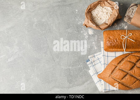 Bakery products composition on grey background, top view and space for text Stock Photo
