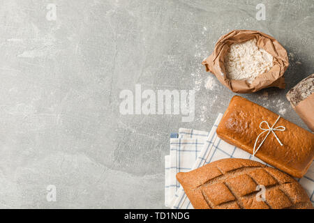 Bakery products composition on grey background, top view and space for text Stock Photo