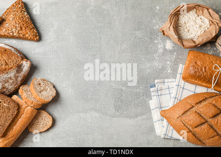 Bakery products composition on grey background, top view and space for text Stock Photo