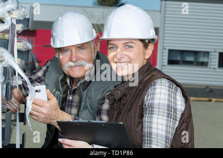 workers outside factory Stock Photo