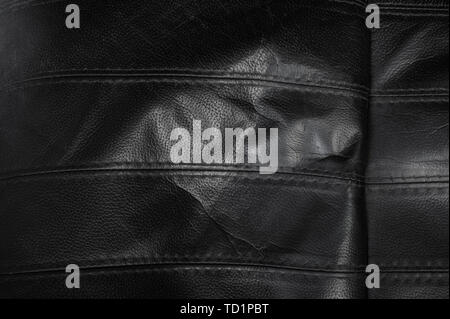 Black torn leather texture with stripes, surface background Stock Photo