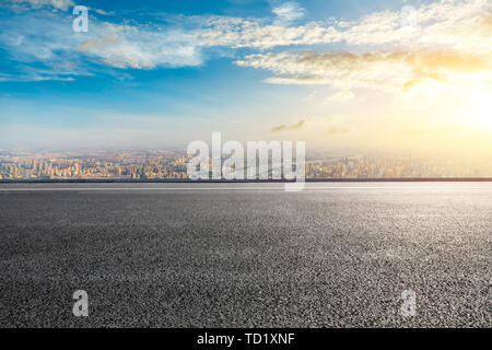 Empty highway road and modern city skyline in Shanghai,China Stock Photo