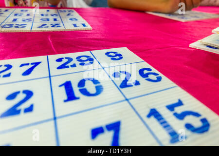 Bingo boards are on the table at the festival Lopburi Thailand Stock Photo