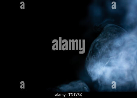 White smoke on a black background Stock Photo
