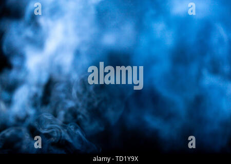 Blue smoke on a black background Stock Photo