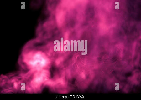 Purple and pink smoke on a black background Stock Photo