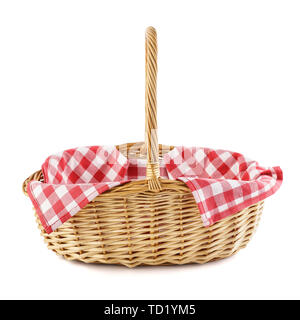 Empty wicker basket with red checkered tablecloth for picnic. Isolated on white. Side view. Stock Photo