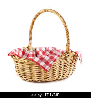 Empty wicker basket with red checkered tablecloth for picnic. Isolated on white. Stock Photo