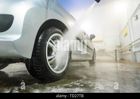 a man cleaning car interior by use foam chemical and scrubbing machine  Stock Photo - Alamy