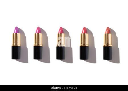 Set of color lipsticks isolated on white background. Flat lay, top view Stock Photo