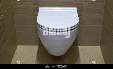 Mounted toilet bowl. Closed Toilet in the toilet Stock Photo