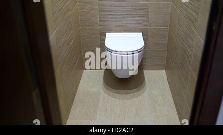 Mounted toilet bowl. Closed Toilet in the toilet Stock Photo