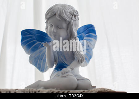 Little girl with blue wings Stock Photo