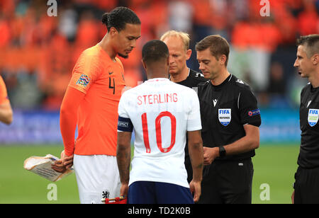 Netherlands' Virgil van Dijk, left, leads team members as they train