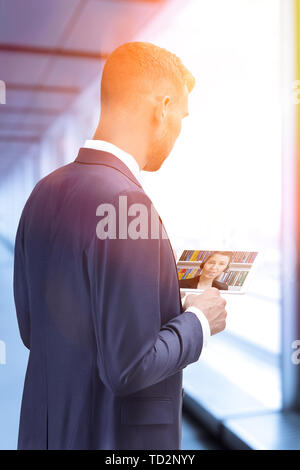 Man video conferencing with lawyer on tablet computer. Video call and online service concept. Stock Photo
