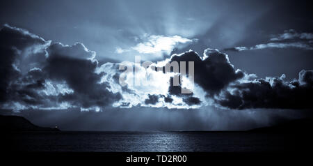 Storm approaching Lerwick in the Shetland Isles, North of Scotland, UK as the sun bursts through the clouds. Stock Photo