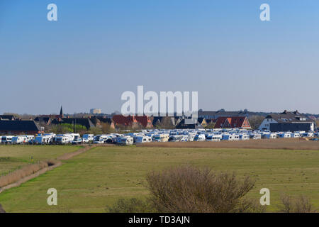 Sankt Peter-Ording, Germany - April 19, 2019: A lot of camping trailers parking in famous holiday region Sankt Peter-Ording, northern Germany Stock Photo