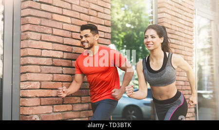 Active couple running every morning in urban Stock Photo