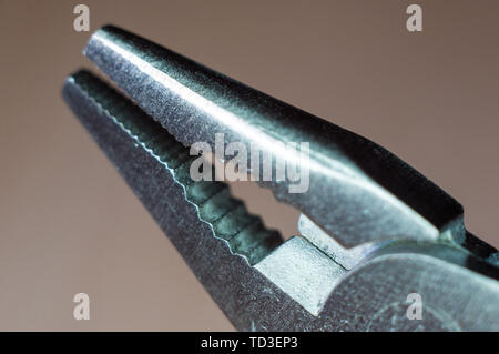 elements small foldable steel multitool, closeup, macro Stock Photo