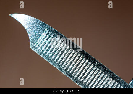 elements small foldable steel multitool, closeup, macro Stock Photo