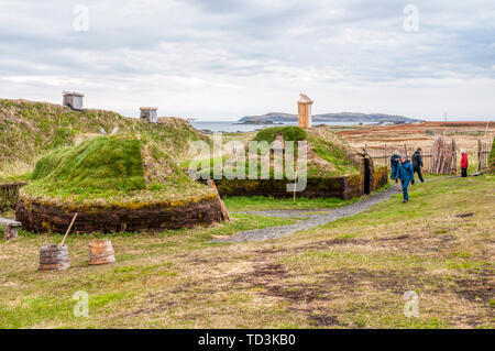 Tourists at the reconstructed Norse or Viking settlement at L’Anse aux Meadows on the Great Northern Peninsula of Newfoundland. Stock Photo