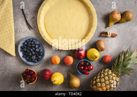 Fresh Dough Fruit Tart Pie Preparation. Ingredients for Baking Cake. Healthy Eating and Diet Concept. Stock Photo