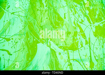 Abstract painted decorative background. Background color UFO Green.Background concrete green wall. Texture of old paint.green or lime painted cement Stock Photo
