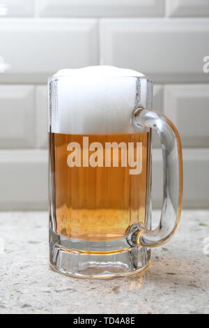 colored beer in beer mug with head Stock Photo - Alamy