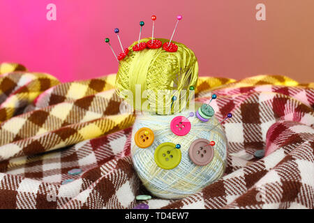 Buttons of different colors, and the two tangle thread on a colorful background Stock Photo