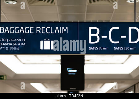 Baggage Reclaim information board inside Prague International Airport - April 2019 Stock Photo