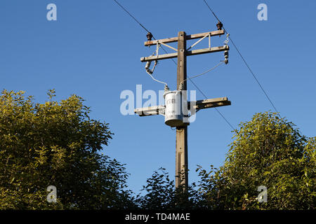 New wooden utility pole with power line wires , cross arm and ...