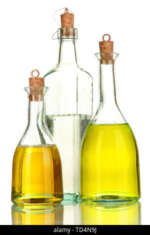 Original glass bottles with salad dressing isolated on white Stock Photo