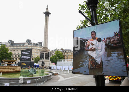 London, UK. 11 June, 2019. Activists from Extinction Rebellion disrupt the Royal Opera House BP Big Screen’s Romeo and Juliet event in Trafalgar Square in protest against oil sponsorship of the arts. Activists at the ‘Petroleo and Fueliet’ protest highlighted the contradiction between the Government and Greater London Authority having declared a climate emergency and BP being given a platform to sponsor the Royal Opera House event in the heart of London. Credit: Mark Kerrison/Alamy Live News Stock Photo