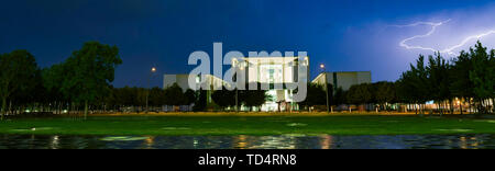 Berlin, Germany. 11th June, 2019. Lightning flashes across the sky during a thunderstorm at the Federal Chancellery. Credit: Paul Zinken/dpa/Alamy Live News Stock Photo