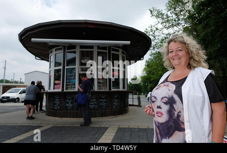Sangerhausen, Germany. 07th June, 2019. Carola Wiehart, operator of the round kiosk at Sangerhausen station at her workplace. The building was opened in 1963 and is a listed building. (to 'Places with cult status - Special kiosks in Saxony-Anhalt') Credit: Sebastian Willnow/dpa-Zentralbild/ZB/dpa/Alamy Live News Stock Photo
