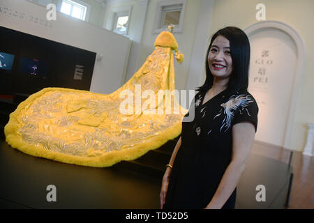 Singapore. 12th June, 2019. Chinese fashion designer Guo Pei (2nd L ...