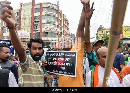 Kolkata, India. 12th June, 2019. Kolkata, India. 12th June, 2019. Bharatiya Janata Party (BJP) activists chant slogan during the protest in Kolkata. Bharatiya Janata Party workers protest against the killings of the BJP workers and also highlighting the alleged deterioration of law and order in the state, the Police used water cannons and tear gas shells towards the protesters who held a rally at Kolkata Police headquarters. Credit: SOPA Images Limited/Alamy Live News Stock Photo