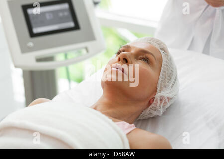 Before the procedure. Face of a nice serious aged woman before the beauty procedure Stock Photo
